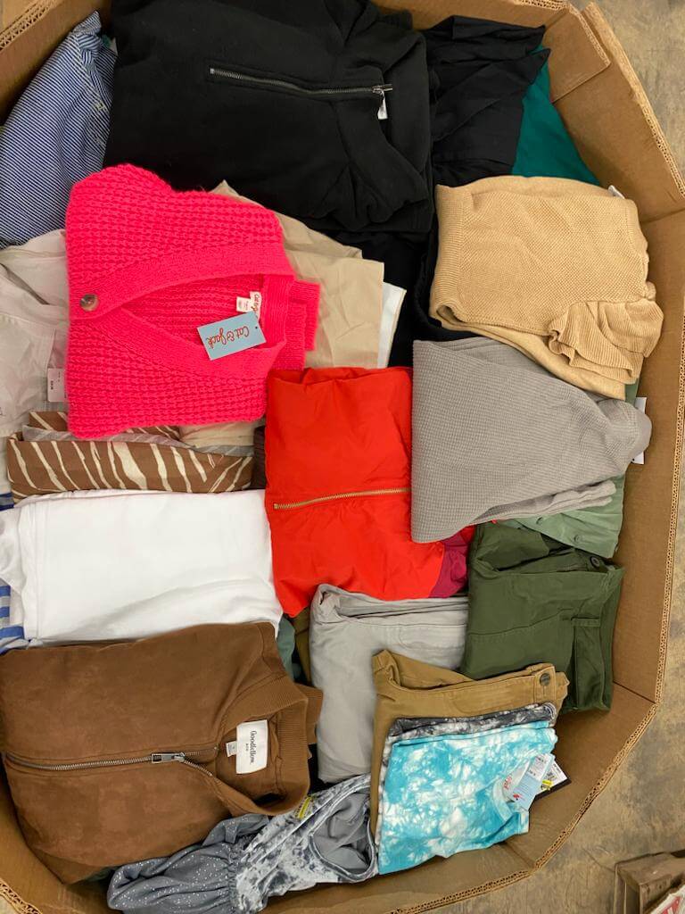 Load image into Gallery viewer, Target liquidation truckload featuring new apparel for all ages including shirts, pants, and outerwear