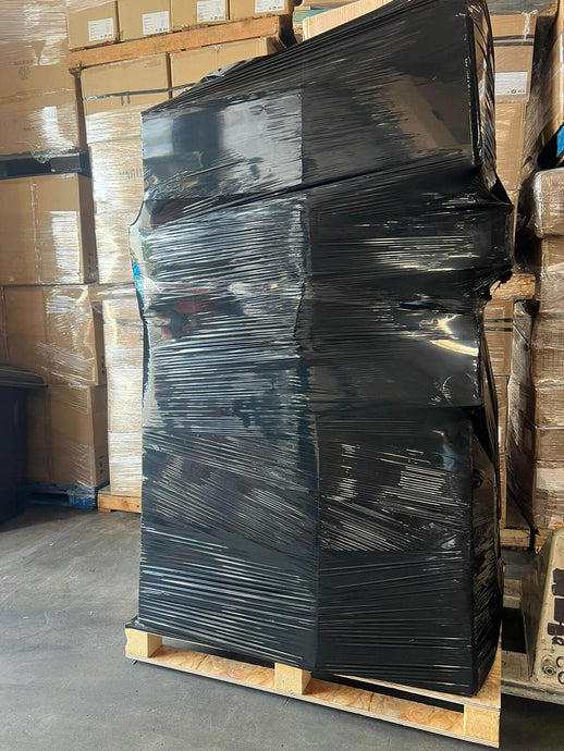 Amazon general merchandise truckload featuring black wrap pallets with shelf pulls and returns